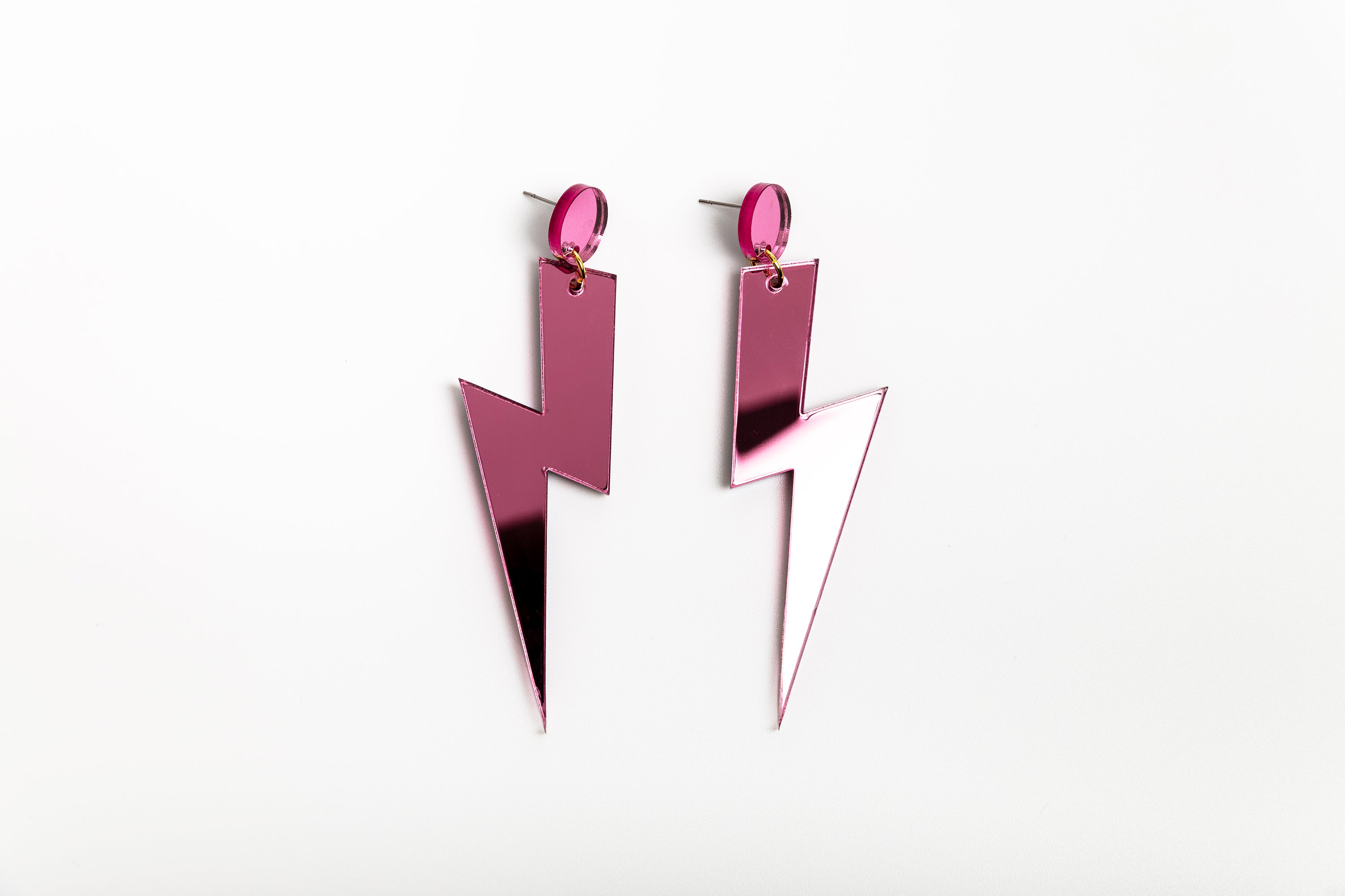 Pink statement lightning bolt earrings