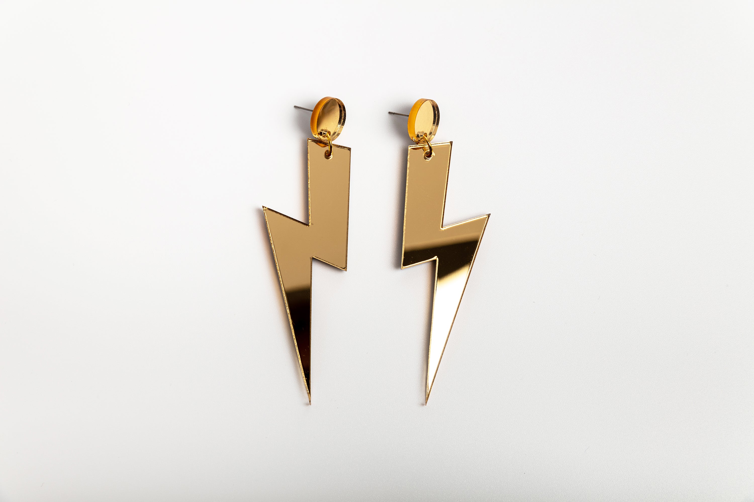 Gold statement lightning bolt earrings