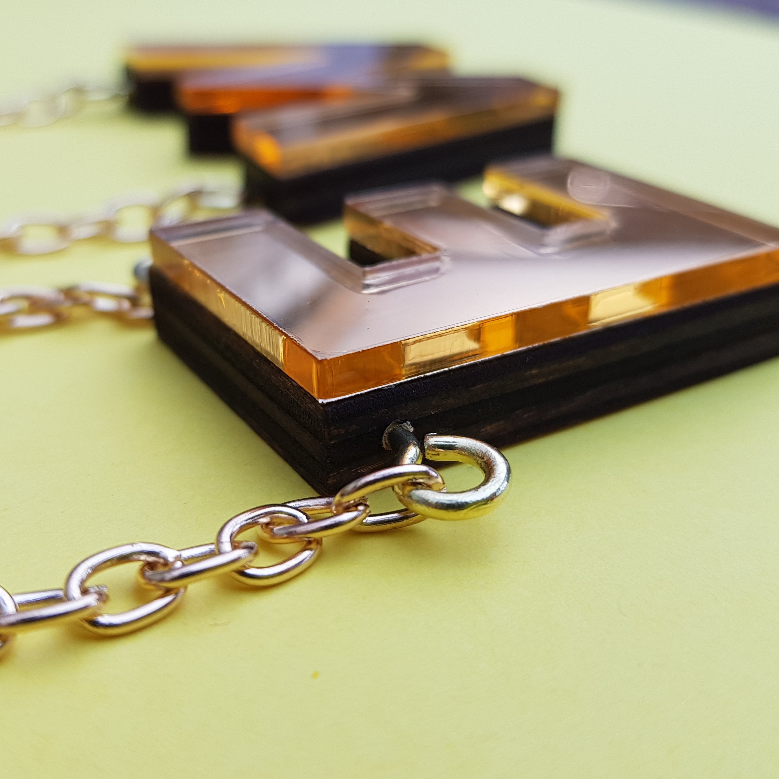 Chunky gold perspex letter necklace