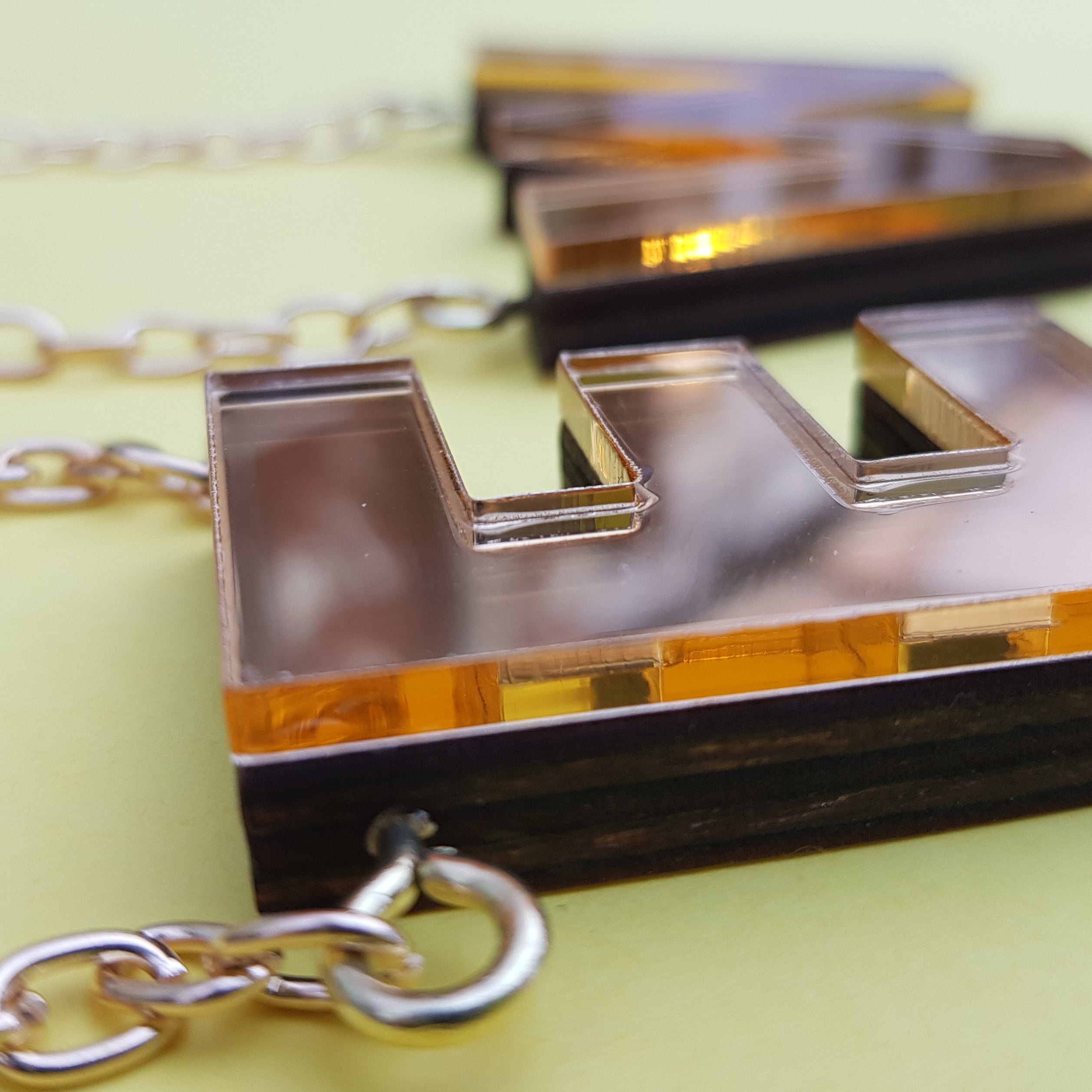 Chunky gold perspex letter necklace