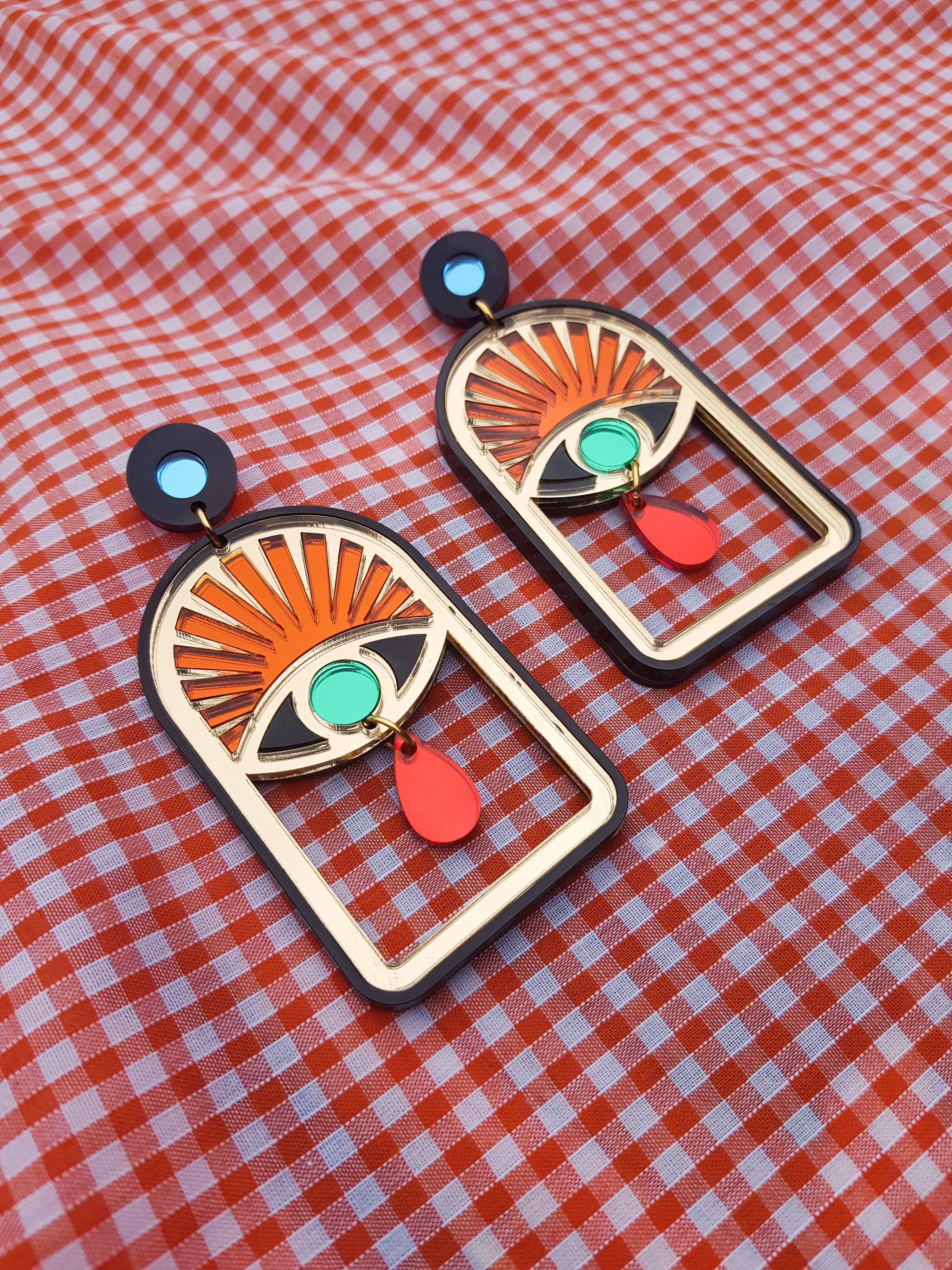 Statement sunrise eye arch earrings