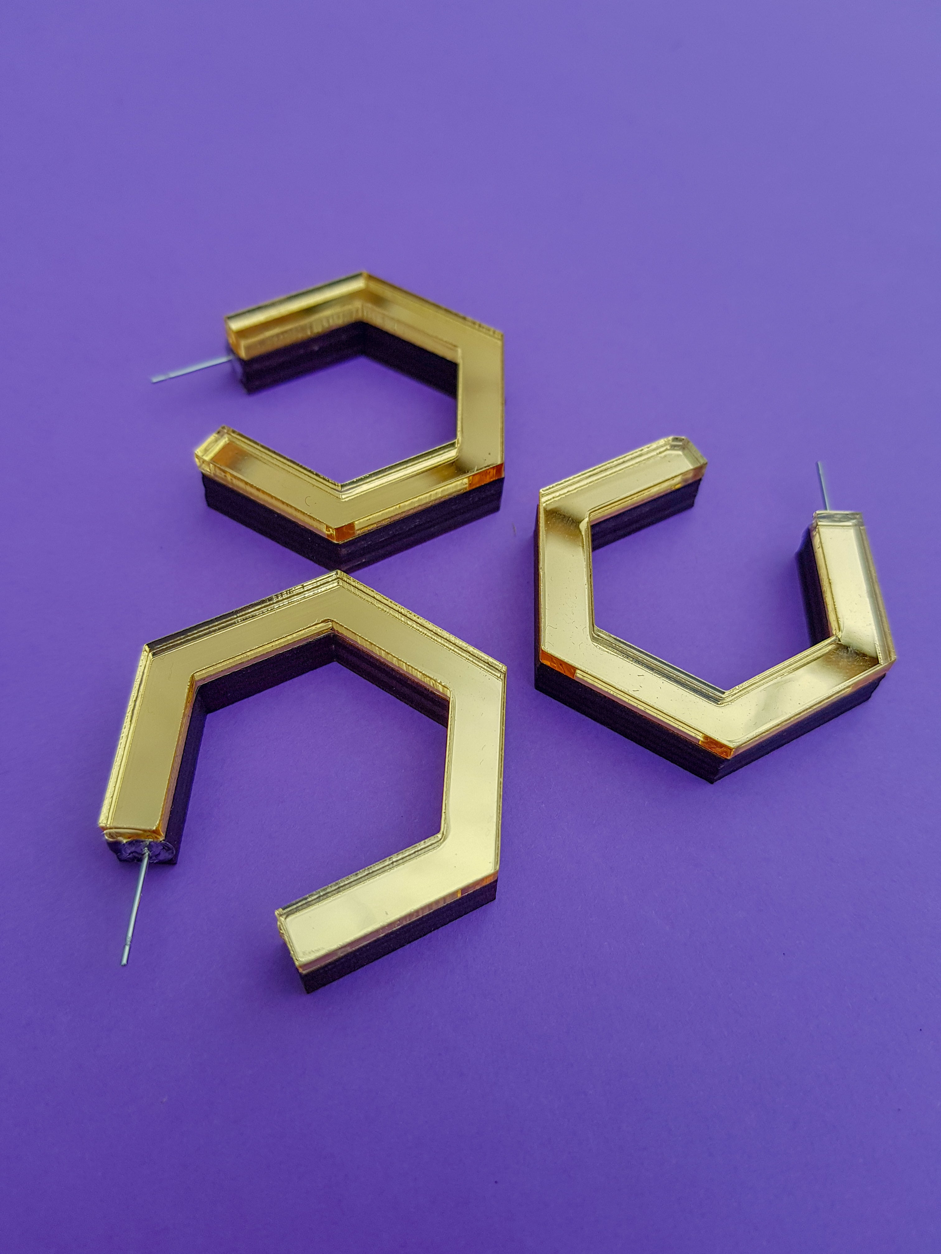 Gold hexagonal ply and perspex hoop earrings
