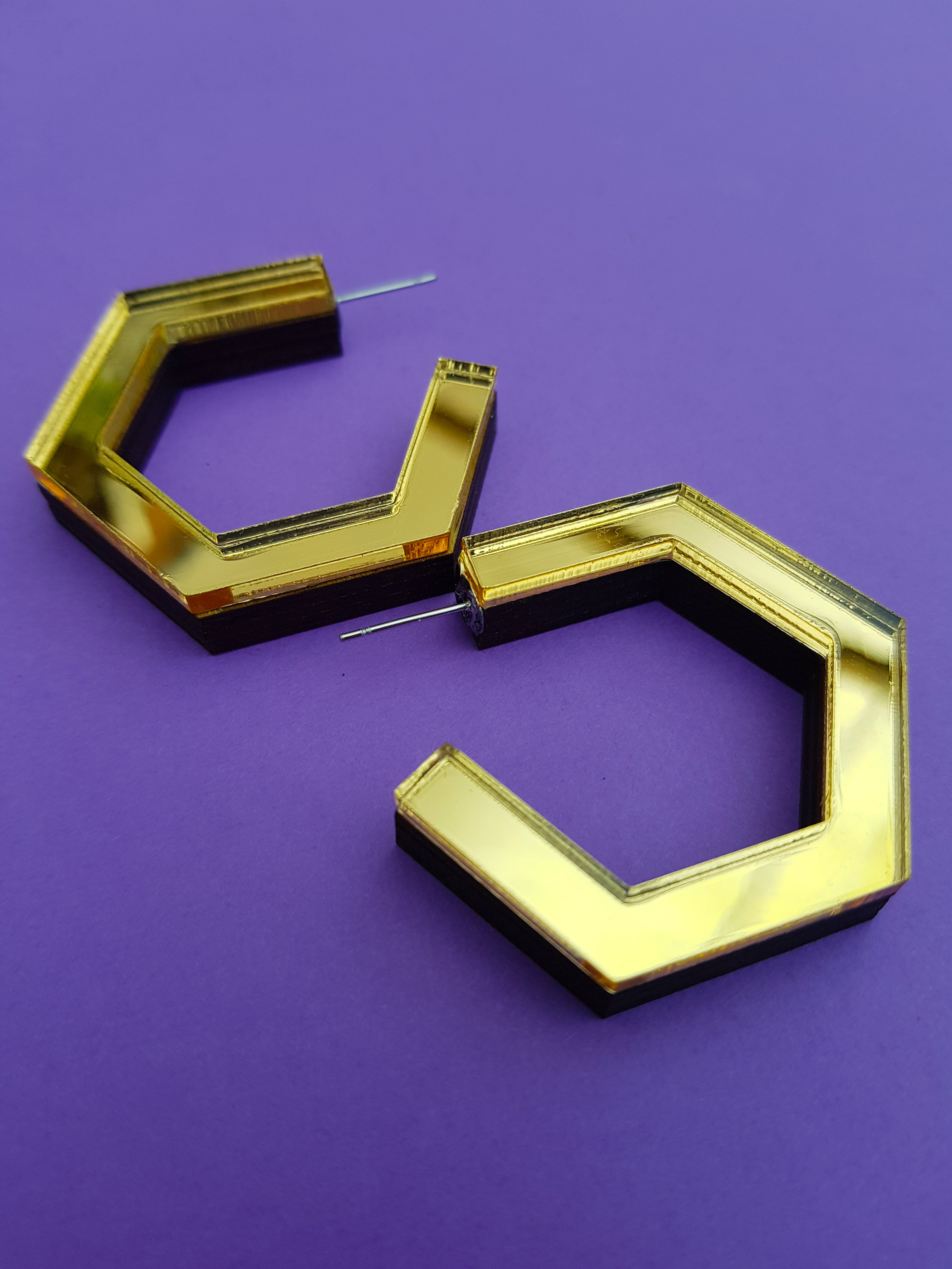 Gold hexagonal ply and perspex hoop earrings