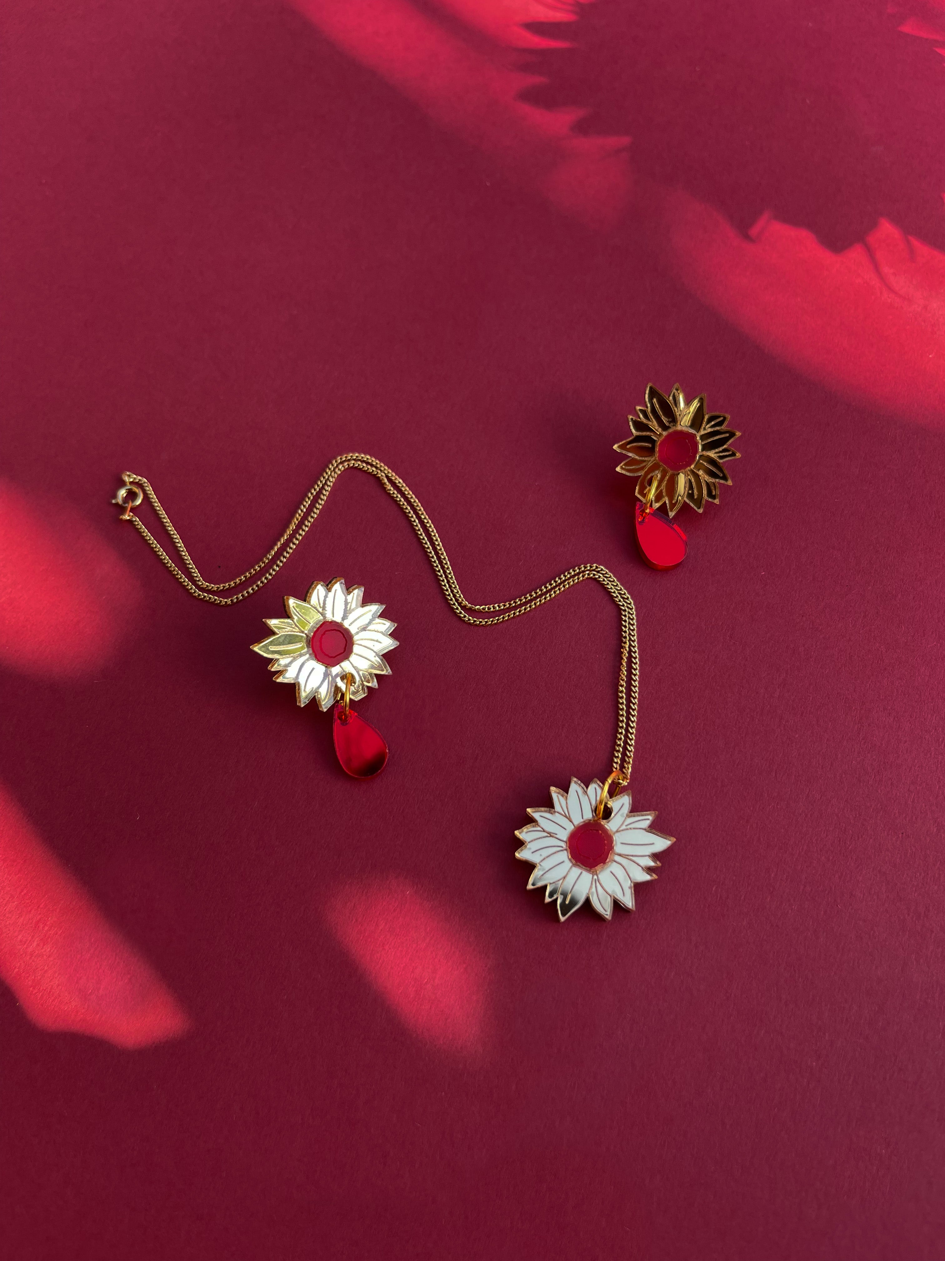 Sunflower stud with red drop
