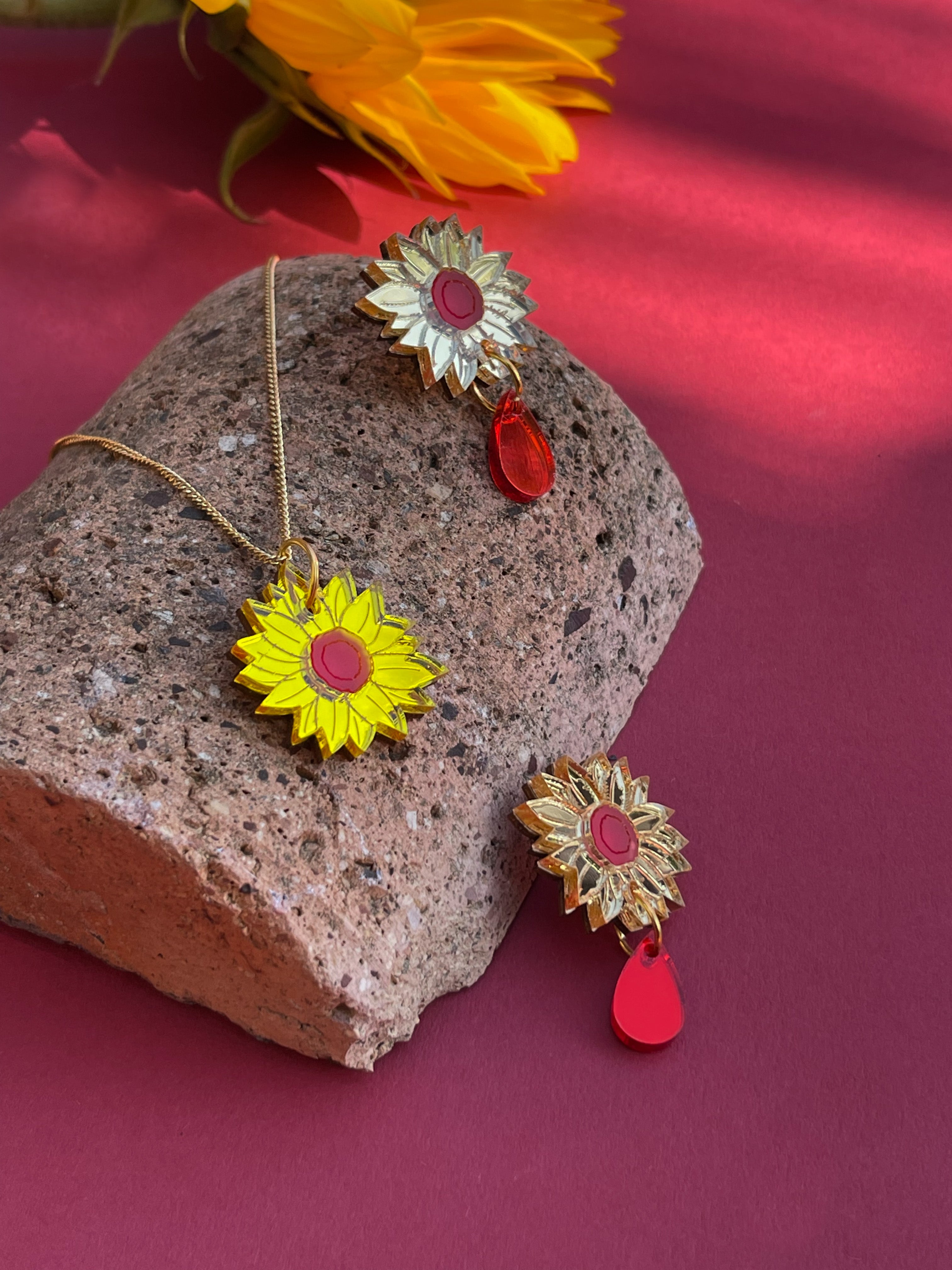 Sunflower stud with red drop